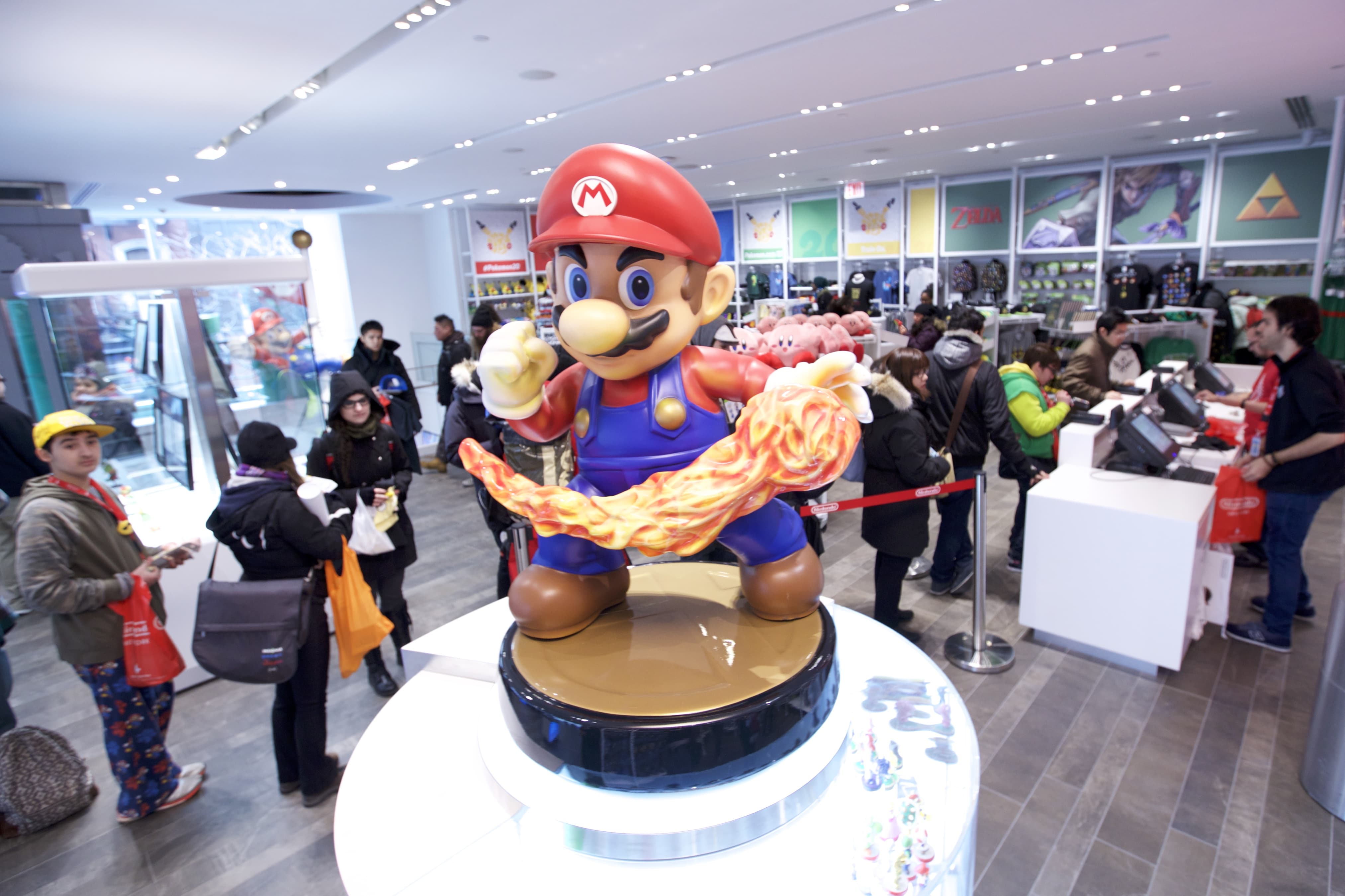 In this photo provided by Nintendo of America, guests explore the remodeled Nintendo NY store at the reopening on 19th February 2016.